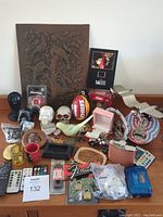 Full overview of all items including copper art, skulls, jewelry boxes, bird pipe, and various collectables.