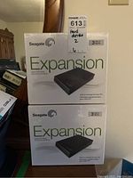 Two stacked Seagate Expansion retail boxes front view showing brand, model name, and capacity.