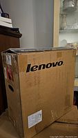 Photo of the Lenovo branded box containing the desktop computer