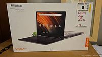 Front of retail packaging showing Lenovo Yoga A12 graphic and branding