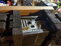 Desktop tower nested in foam inserts inside OEM cardboard box