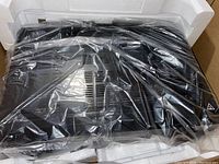 Receiver wrapped in plastic and fitted in white styrofoam inside original box