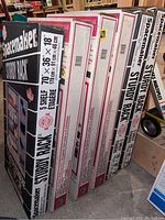 Six long boxes including three black Spacemaker Sturdy Rack boxes and three white/red heavy duty steel shelving boxes