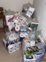 Overall view of stacked multipacks of toilet paper and tissue boxes