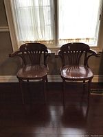 Front view of both chairs side by side showing overall style and finish