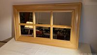 Full view of the rectangular 6 pane mirror with natural maple wood frame, showing the six separate mirror panes separated by wooden division bars.