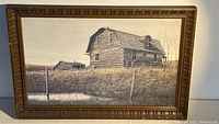 Full framed print of log farmhouse artwork depicting western Canadian rural life.