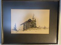 Full frontal view of the framed watercolour showing barn scene and black mat.