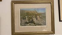 Framed pastel painting showing New Mexico landscape with mesas and washes.