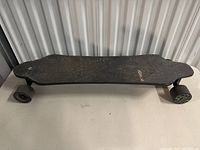 Front top view of the Exway X1 Pro skateboard showing the deck and wheels.