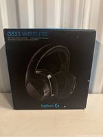 Front view of the Logitech G533 Wireless Gaming Headphones box showing the model and key feature of DTS 7.1 surround sound.