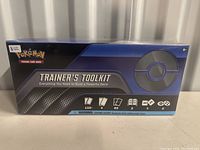 Front of sealed Pokemon Trainer's Toolkit box featuring Pokemon branding and contents listed