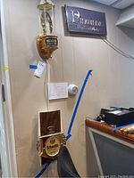 Wall mounted Michelob, Schmidt's, and Pinwinnie advertising electric light signs in a basement or bar setting.