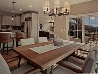 Front angle view showing wood tabletop surface and metal trestle base