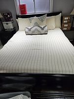 Assembled bed with duvet cover and pillows