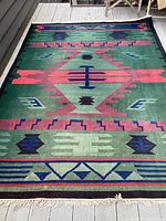 Full view of the Southwestern area rug laid out flat, showing complete geometric pattern and size.