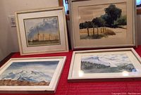 Four watercolor paintings, three signed by C Addison Van Loenen and one unsigned, displayed on a red surface showing frame and mat details.