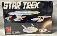 Front of sealed box showing three U.S.S. Enterprise starship models with Star Trek logo and AMT branding.