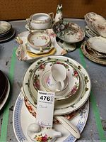 Overview of the dishware assortment including bowls, creamers, and serving pieces in floral Royal Albert and Royal Doulton patterns