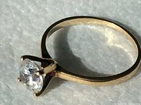 Side profile showing ring band and solitaire stone