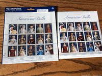 Photo showing two sheets of Classic American Dolls postage stamps laid flat with visible stamp images.