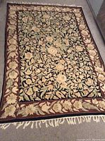 Full top view of the tapestry rug laid flat showing overall design and fringe edges.