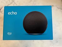 Front of sealed Amazon Alexa Echo 4th Gen smart speaker box showing product image and Alexa logo.