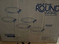 Photo of cardboard box with illustration and branding of Safe-T-Fresh Round Ware containers showing multiple sizes and indicating SureGrip technology.