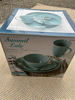 Photo of the boxed dinnerware set showing label and number of pieces included (16)