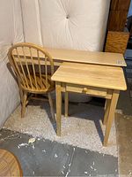 Three-piece wooden furniture set consisting of a sofa table, side table, and chair placed on a carpeted floor, showing their size and finish.