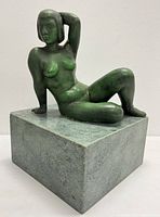 Front-left angled view of seated bronze figure on marble base