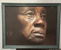 Front view of framed oil painting depicting a tearful woman
