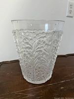 Front view of clear conical vase showing frosted berry and leaf pattern