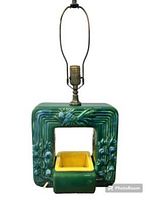 Full view of the green square ceramic lamp with planter insert showing embossed flowers and leaves, light socket on top without bulb.