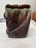 Front and angled view of rectangular Mid-Century Modern Royal Haeger ceramic vase showing organic wrapped design and multicolor glaze in brown, green, and blue tones on glossy finish.