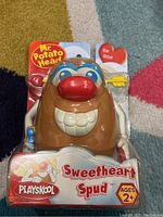 Front view of the new Playskool Mr. Potato Head Sweetheart Spud toy in original packaging showing face and main body.