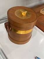 Closed teak wood and brass ice bucket