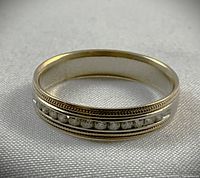 Front view showing channel-set diamonds and milgrain detail