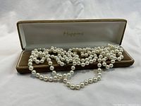 Necklace displayed inside original Mappins box