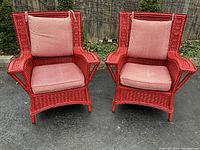 Front view of both red wicker chairs side by side