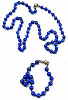 Full view of necklace and bracelet laid flat