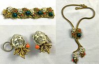 Overview of bracelet, earrings and lariat necklace laid flat