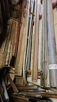 Photo showing a bundle of metal rods and pipes of different diameters stacked vertically.