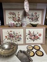 Vintage lot with floral placemats, coasters, silver plated platter, jars, mug, crumb catcher, sauce boat, and Staffordshire hanging wall plate