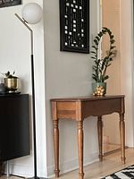 Front right angle view showing turned legs and tabletop finish