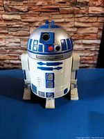 Front view of the R2-D2 Micro Machines head toy showing detailed paint and dome shape.