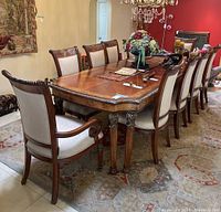 Three-quarter front view of table set among chairs