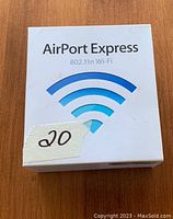 Front view of the white retail box for Apple AirPort Express showing branding and Wi-Fi symbol.