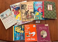 Photo showing ten various children's books including The Pooh Story Book, World of Disney Princesses, Fairy Tales by Gasha Tudor, The Little Mermaid by Walt Disney, Tanglewood Tales, The Berenstain Bears Say Good Night, Green Eggs and Ham by Dr. Seuss, and Best Loved Fairy Tales by Walter Crane.