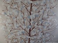 Close-up view of the Lumimarja fabric design showing white and light gray berries on brown branches against a beige background.